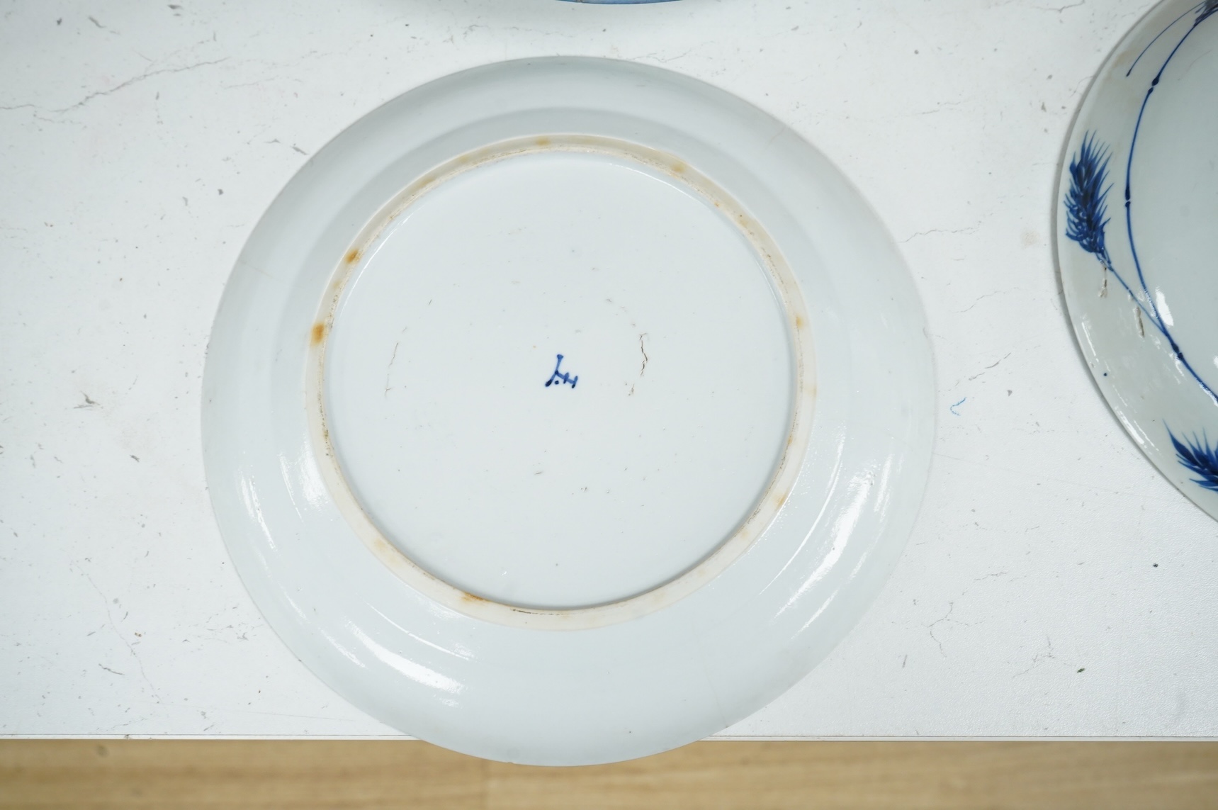Three Chinese blue and white plates, largest 26cm
